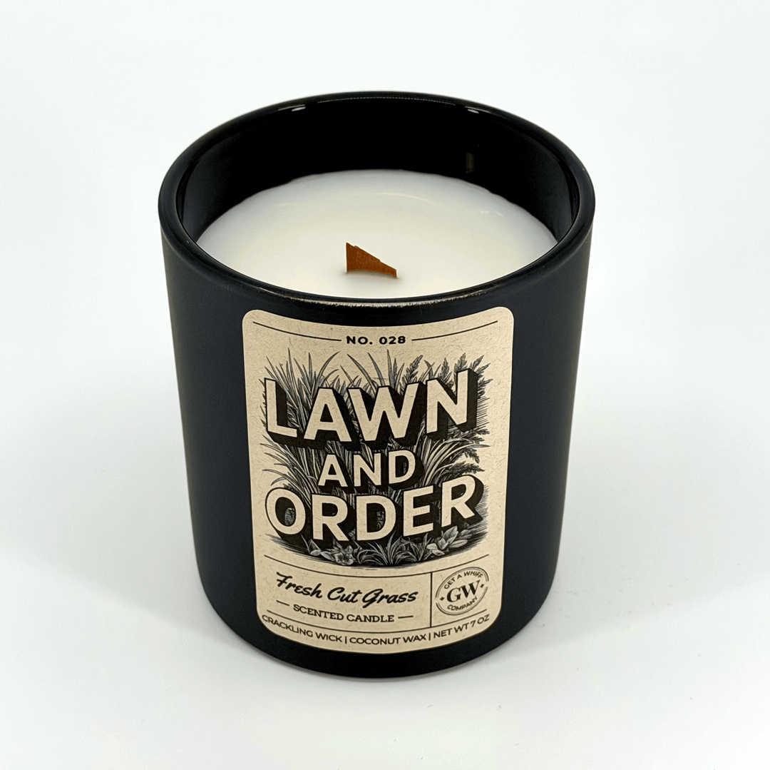 Candle in a black container with &