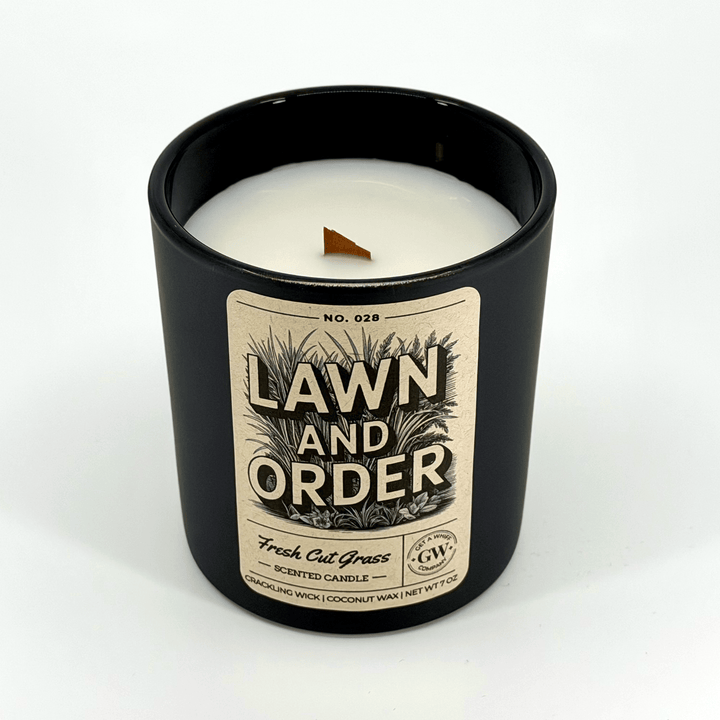 Candle in a black container with &