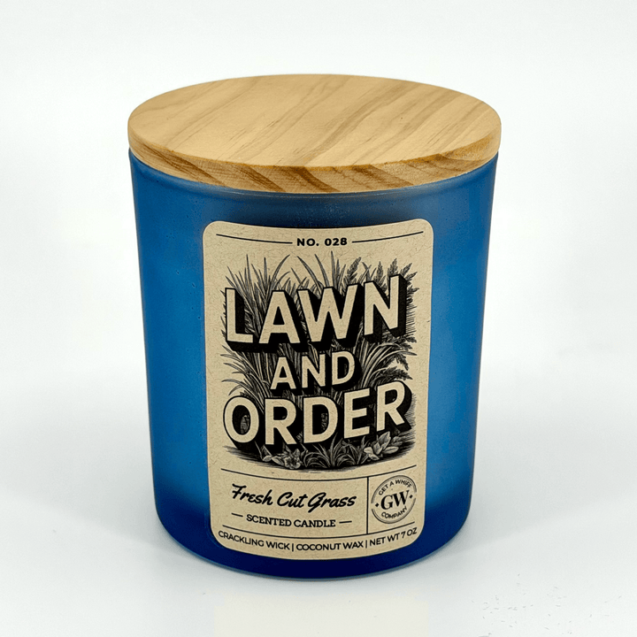 Blue candle with wooden lid labeled &