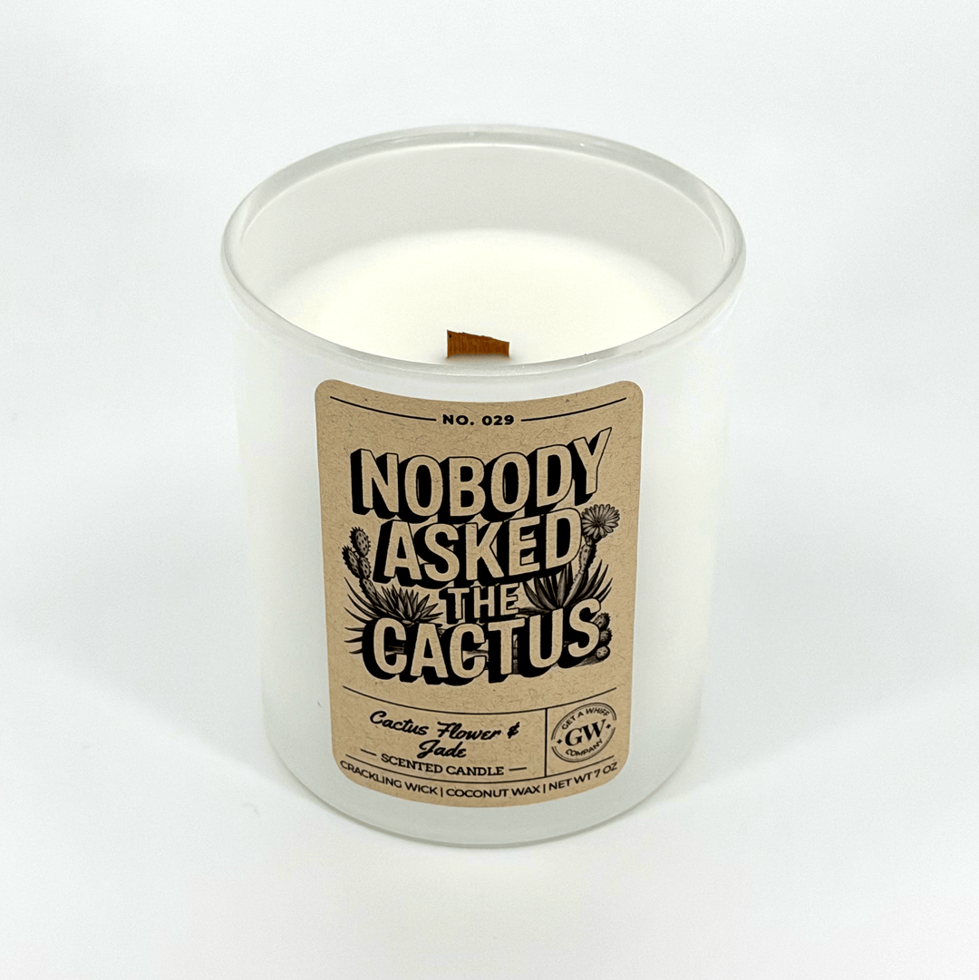 Candle with a label reading &