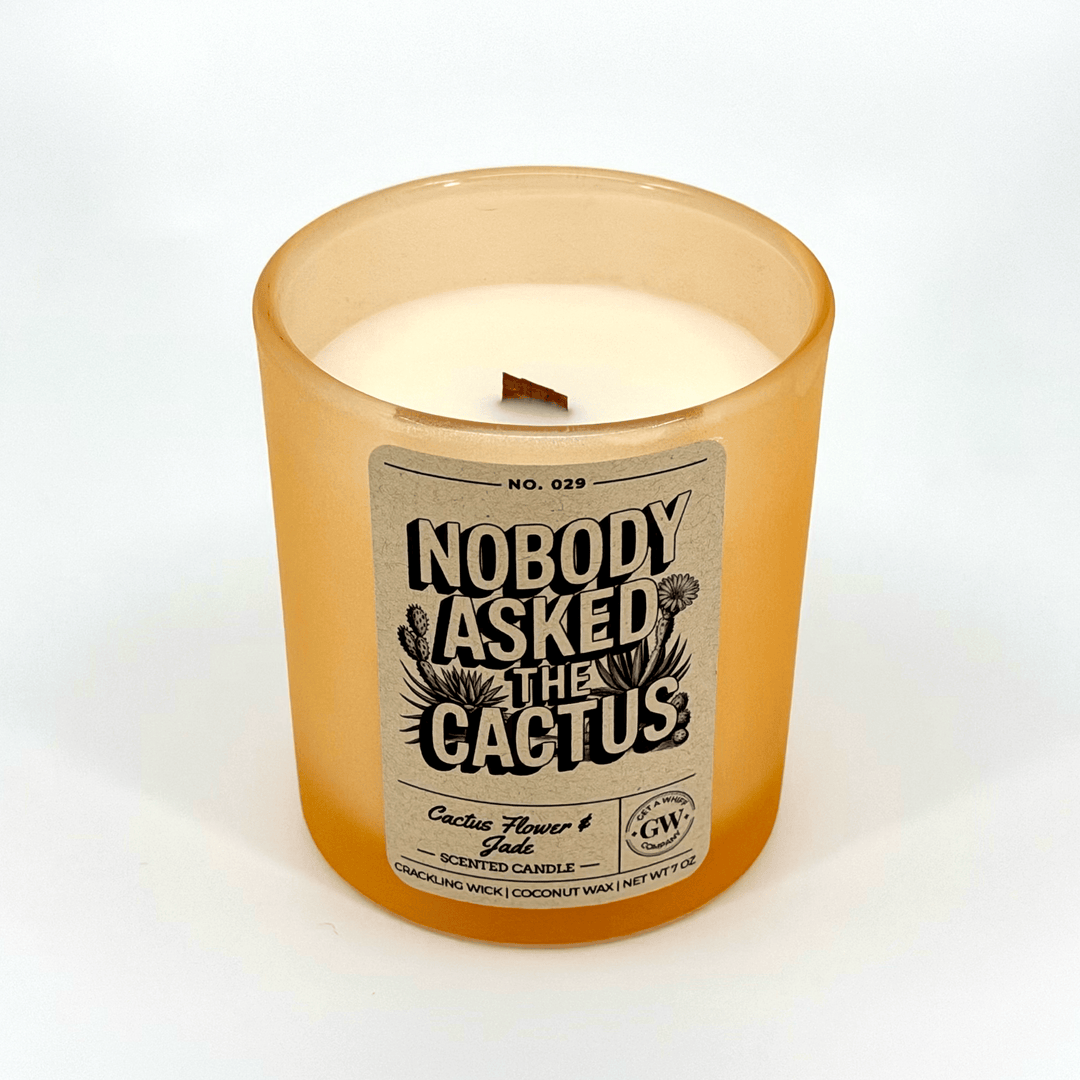 Candle with a label reading &