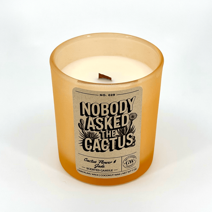 Candle with a label reading &