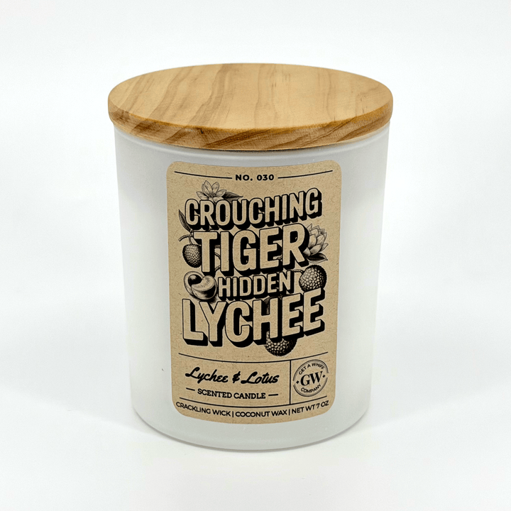 Candle with wooden lid and label on a white background