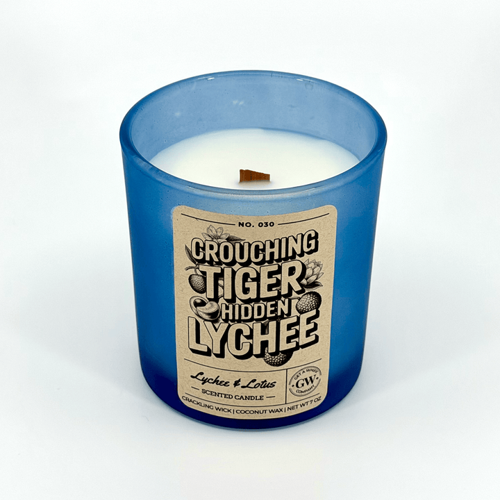 Candle in a blue jar with a label on a white background