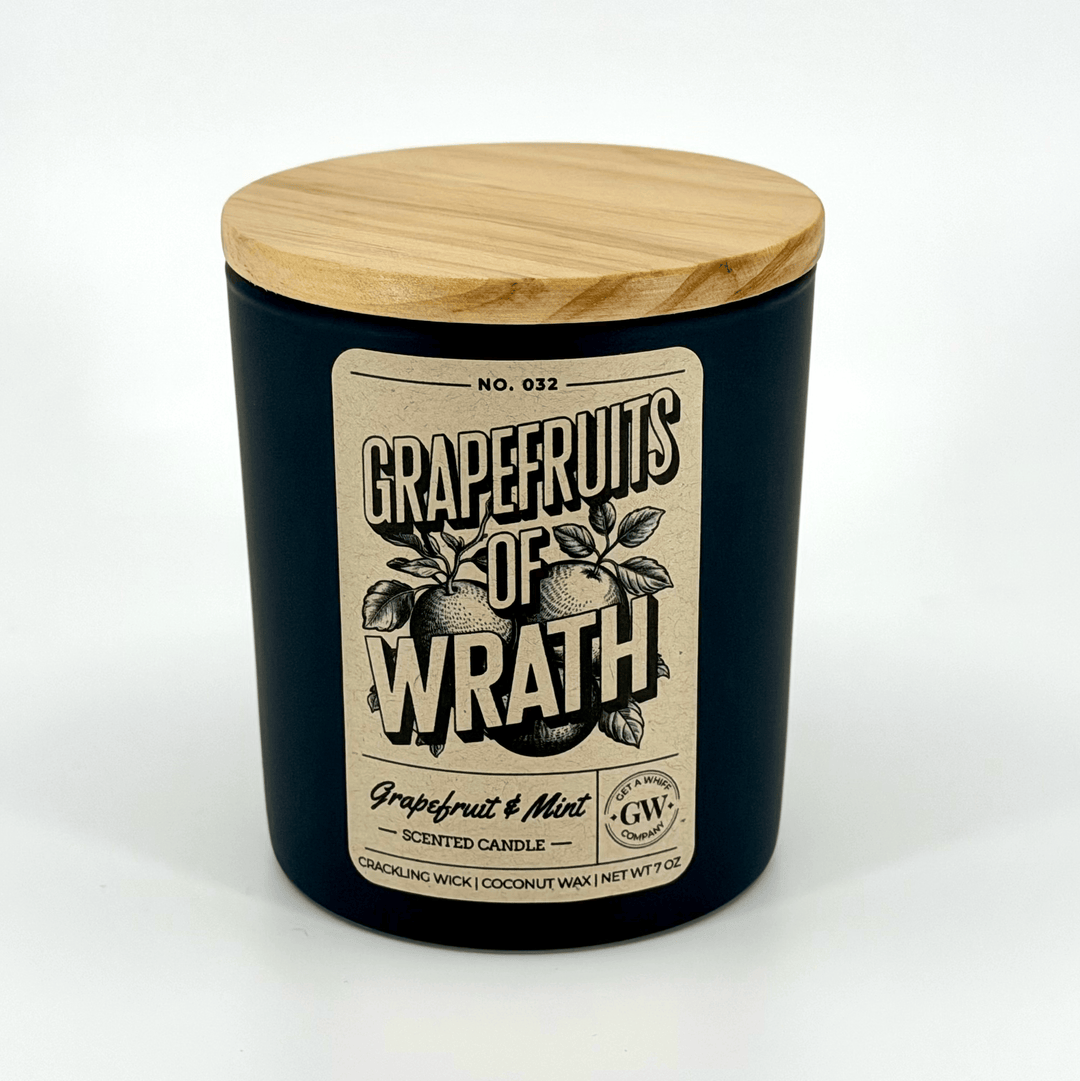 Grapefruits of Wrath scented candle with wooden lid on a white background