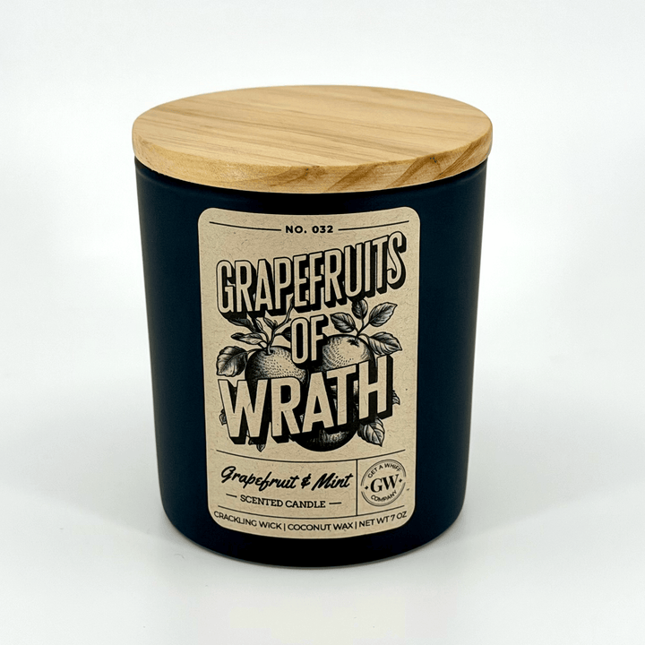 Grapefruits of Wrath scented candle with wooden lid on a white background