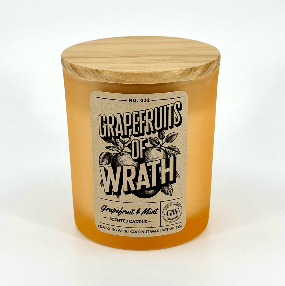 Grapefruits of Wrath scented candle with wooden lid on a white background