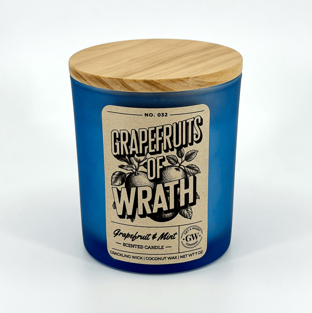 Grapefruits of Wrath scented candle with wooden lid on a white background