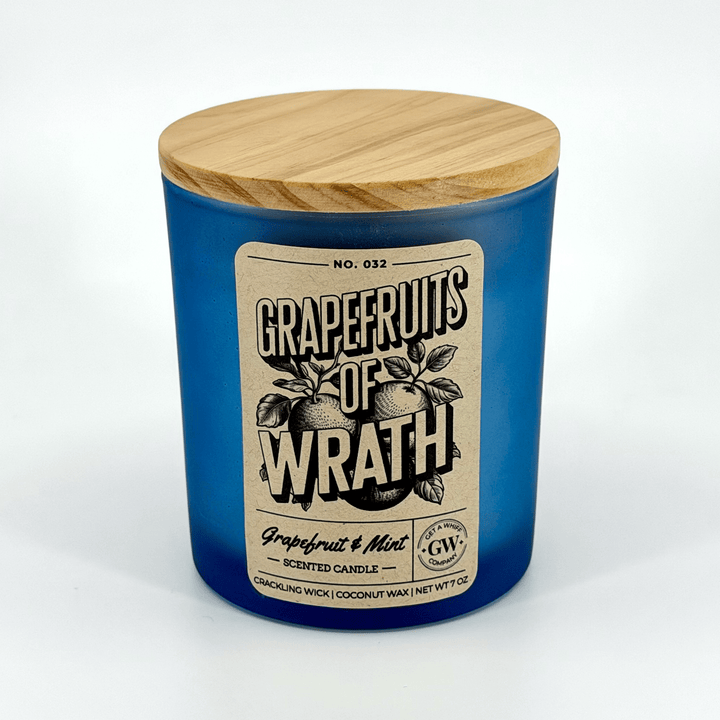 Grapefruits of Wrath scented candle with wooden lid on a white background