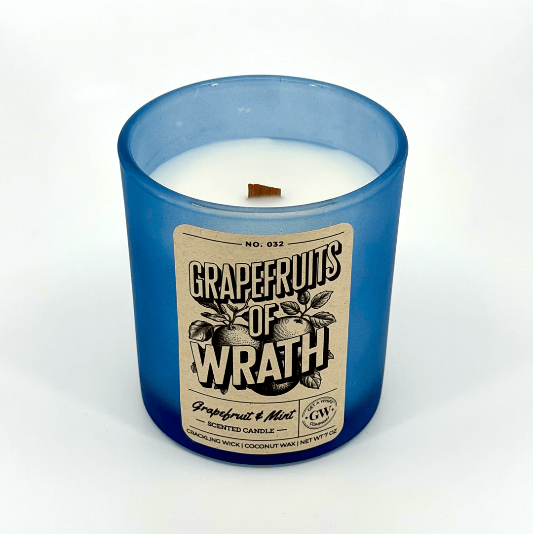 Scented candle with a blue glass jar and &