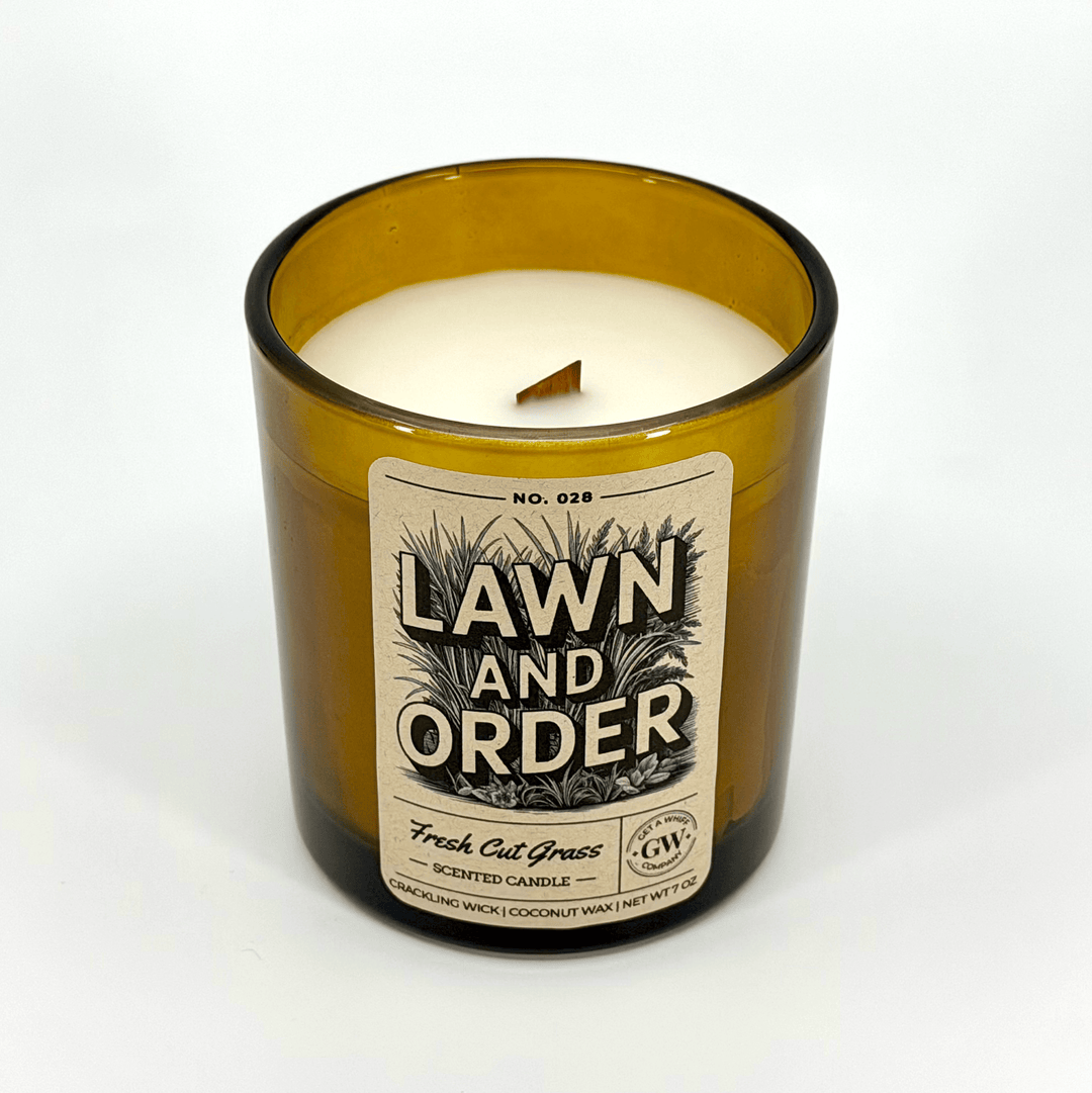 Candle in a glass jar labeled &
