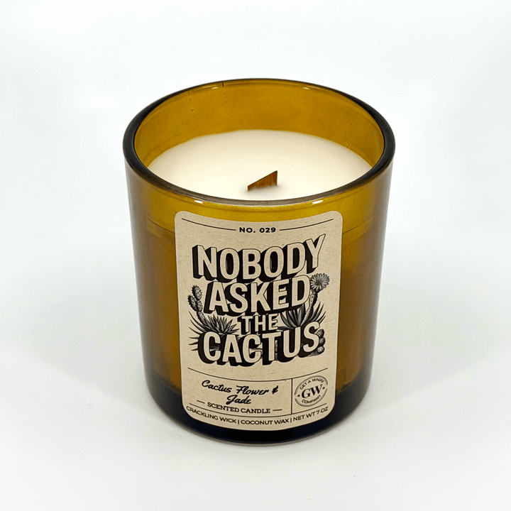 Candle in a bottle with a label reading &