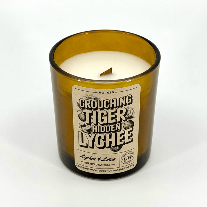 Candle in a glass jar with a label on a white background