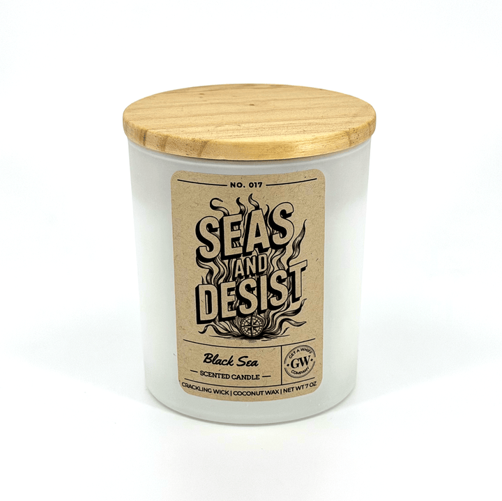Candle with wooden lid and label on a white background