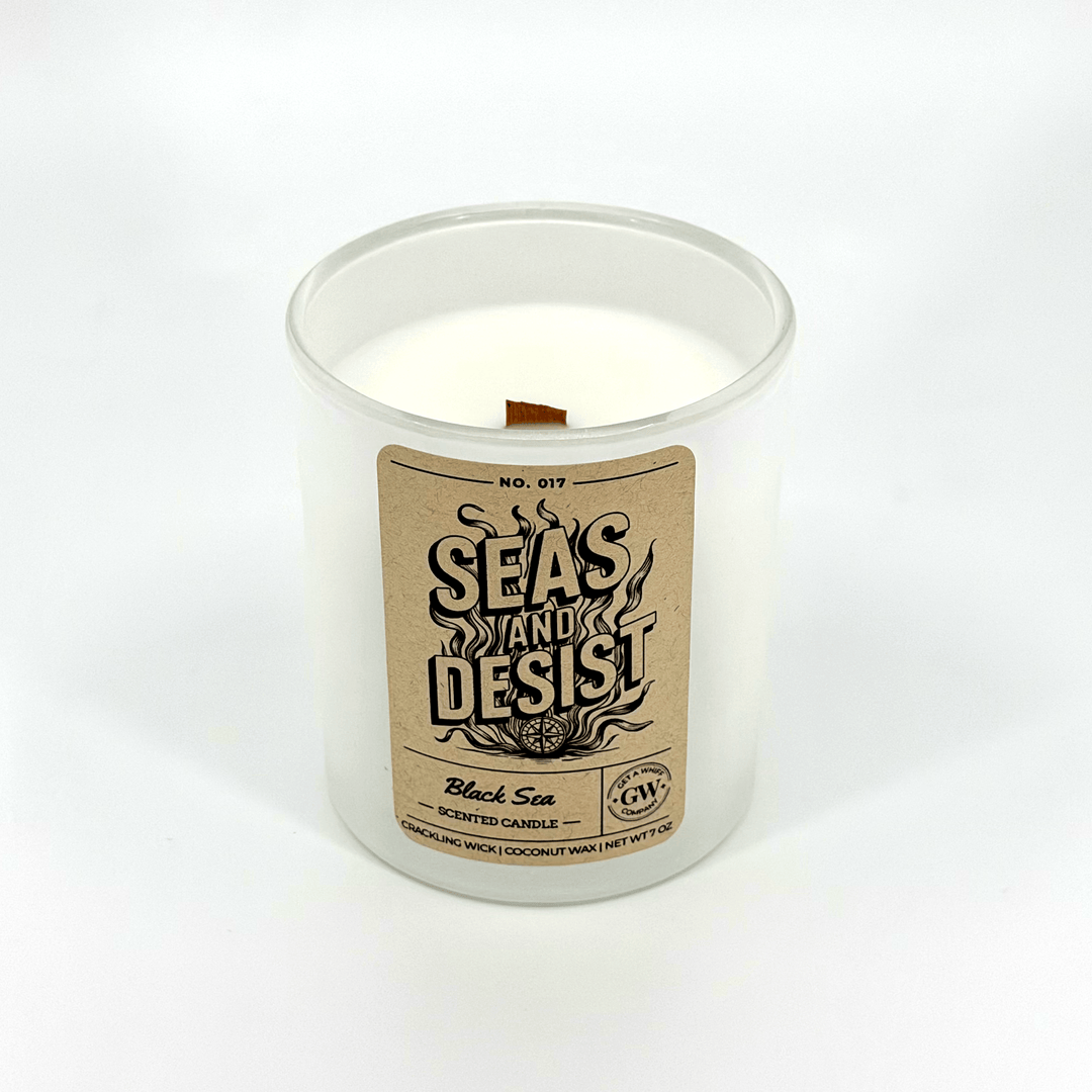 Candle in a glass jar with a label on a white background