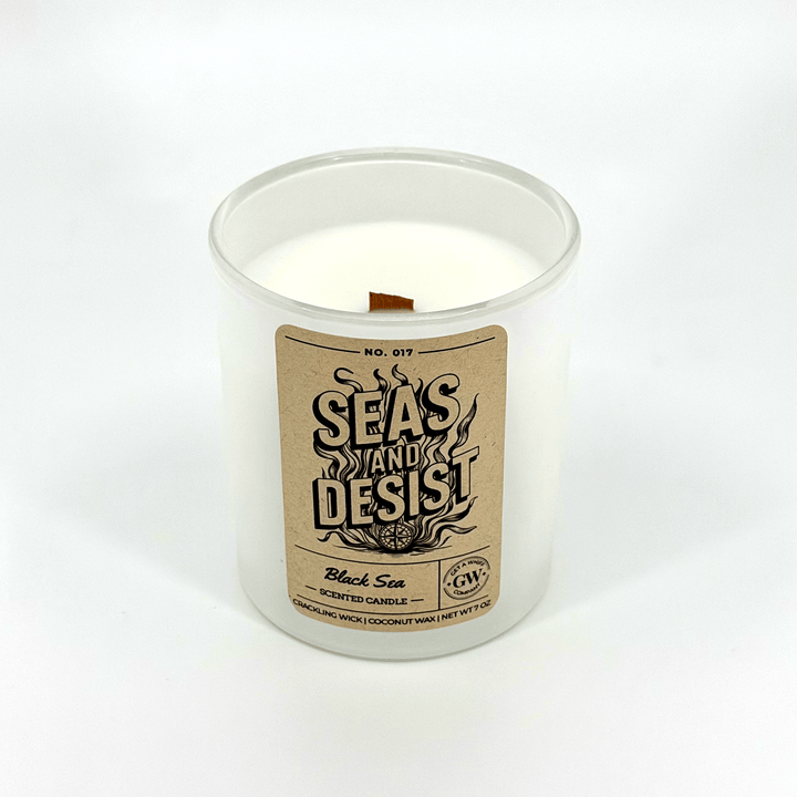 Candle in a glass jar with a label on a white background