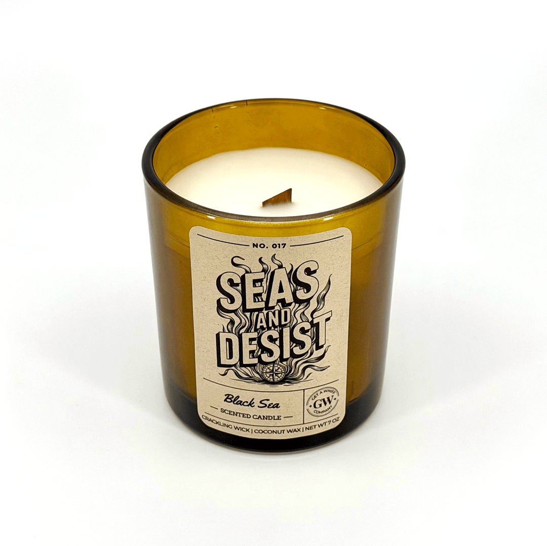 Candle in a glass jar with a label on a white background