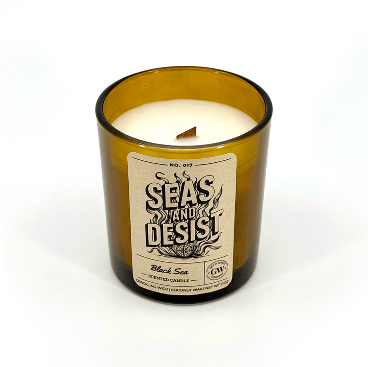 Candle in a glass jar with a label on a white background