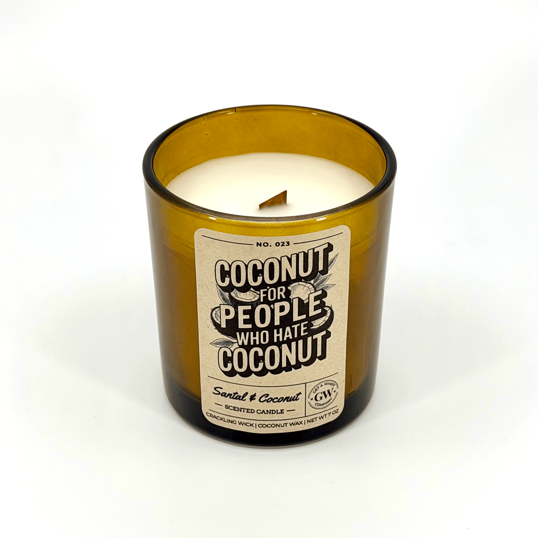 Candle in a glass bottle with a label on a white background
