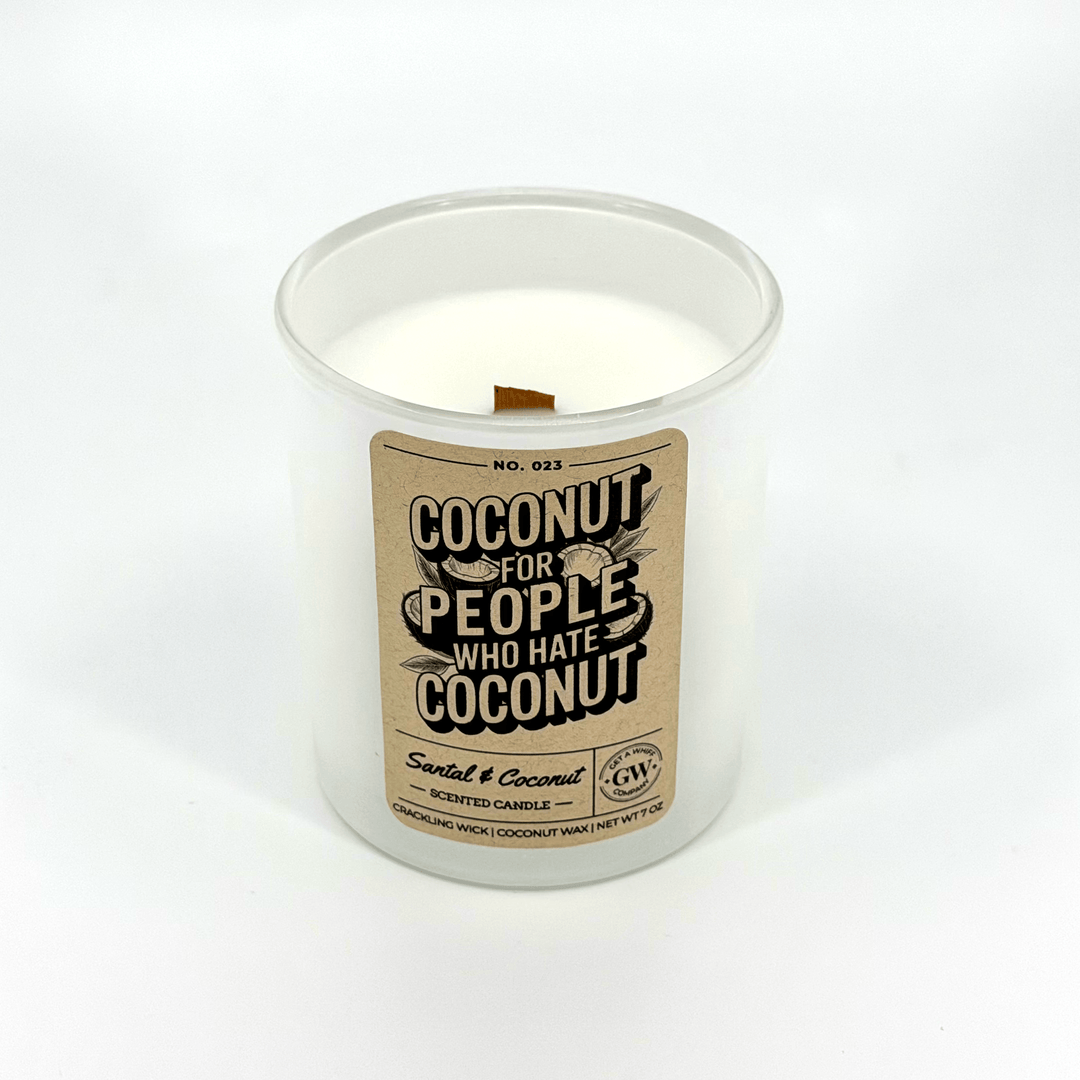 Candle in a white container with a brown label on a white background