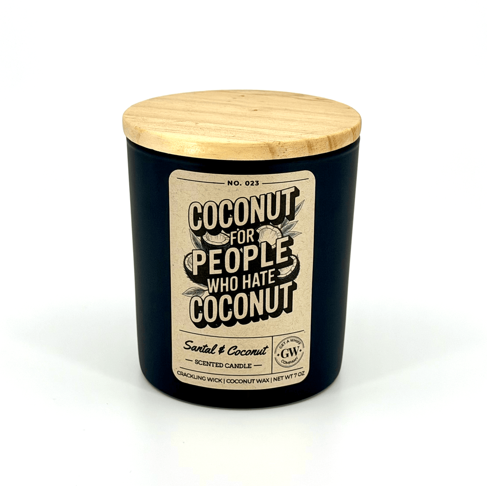 Candle with a wooden lid and humorous label on a white background