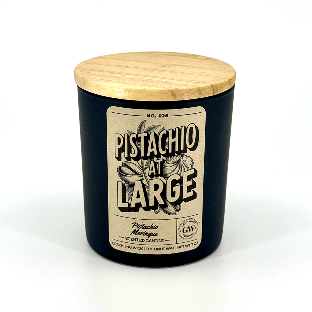 Pistachio scented candle with a wooden lid on a white background