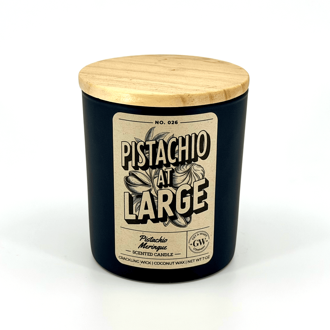 Pistachio scented candle with a wooden lid on a white background