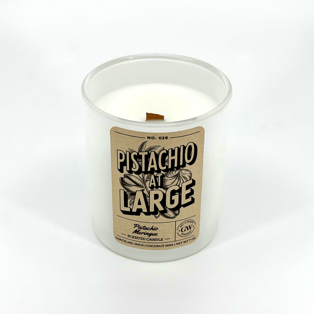 Candle in a white container with a label on a white background