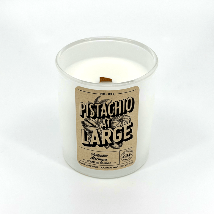Candle in a white container with a label on a white background