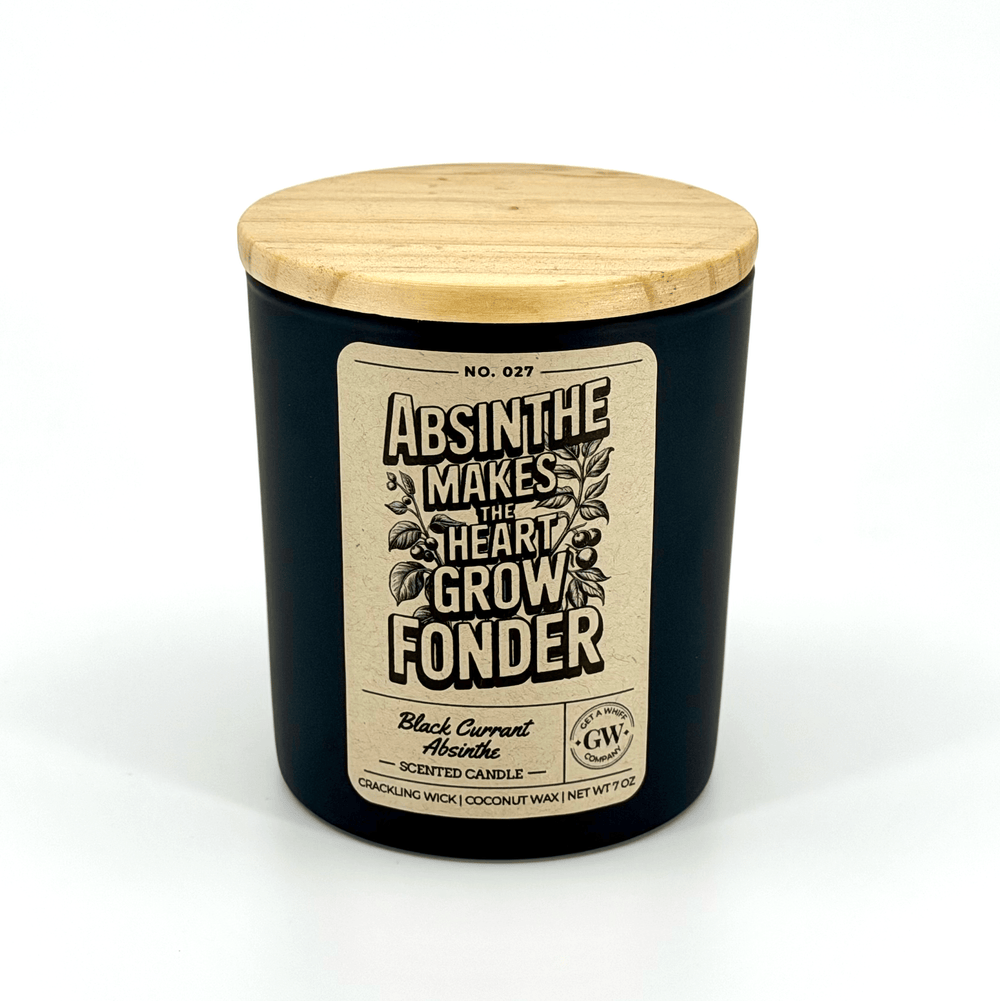 Black candle with wooden lid and decorative label on a white background