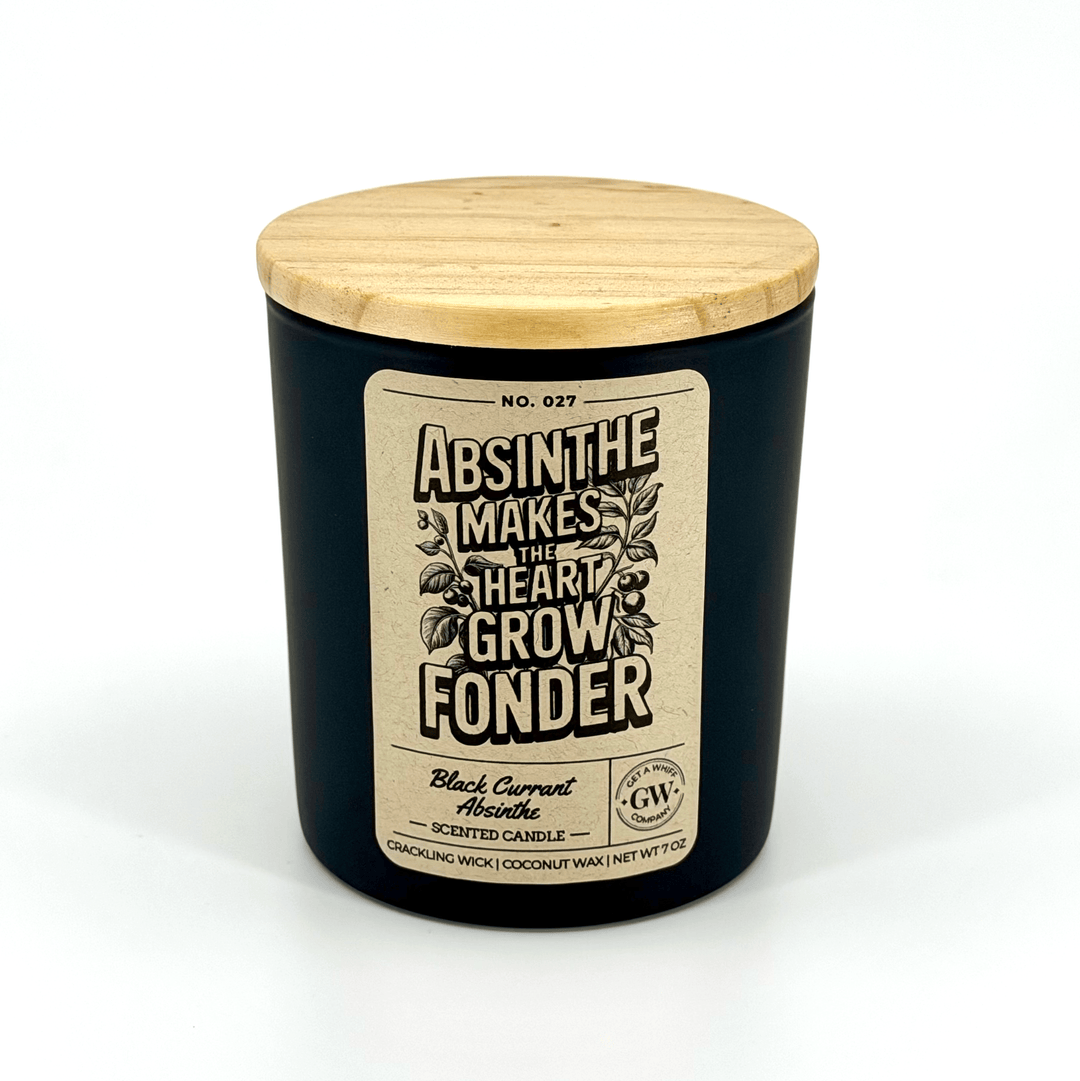 Black candle with wooden lid and decorative label on a white background