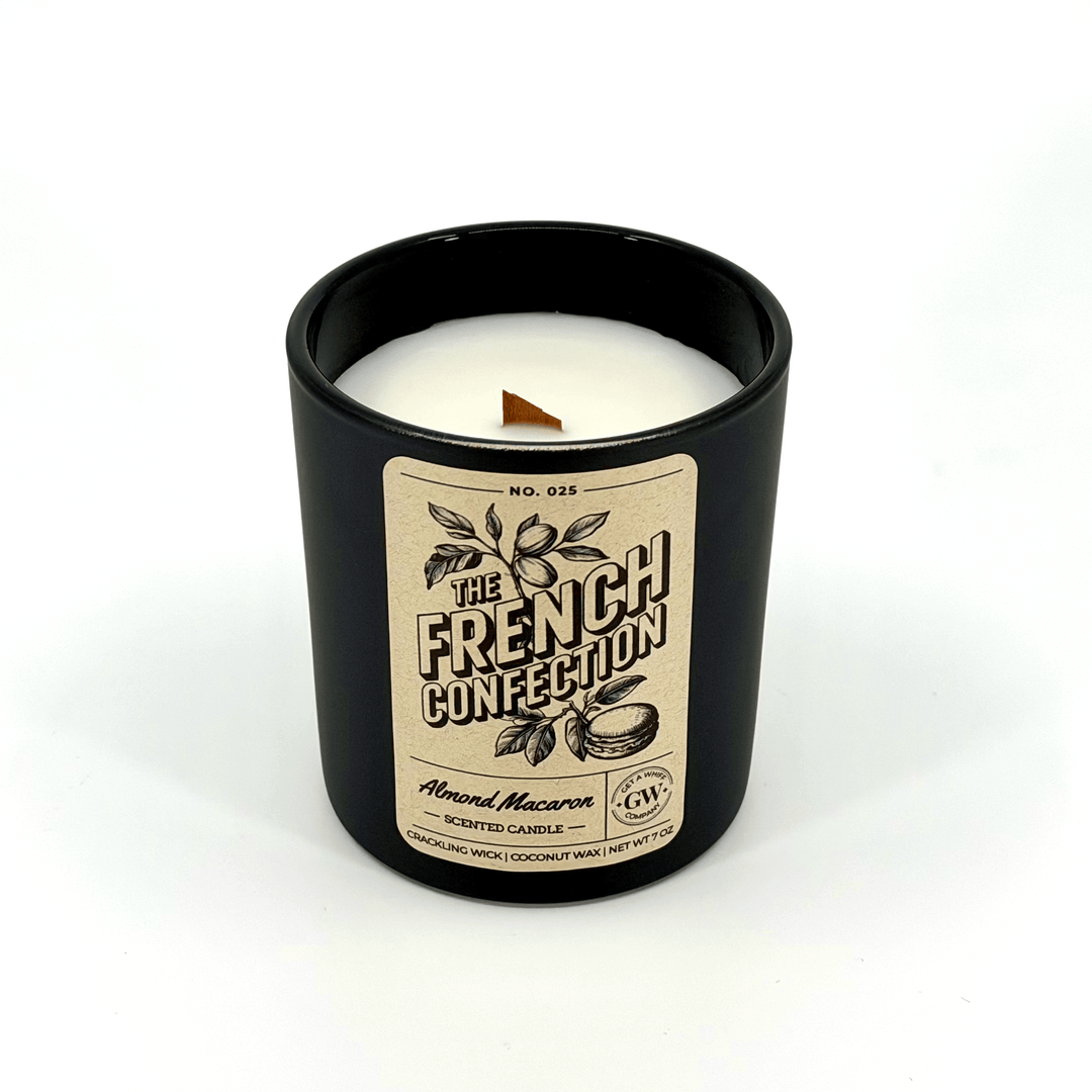 Candle in a black container with a label on a white background
