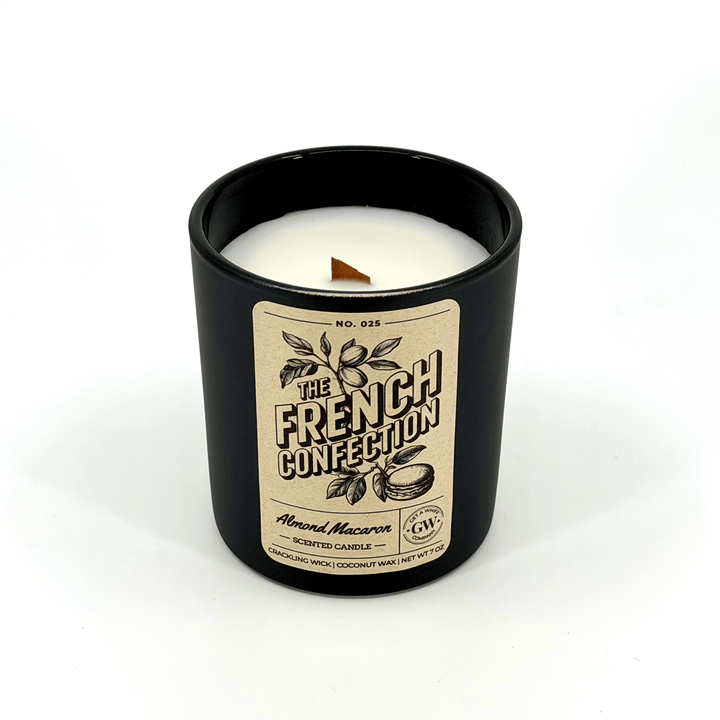 Candle in a black container with a label on a white background