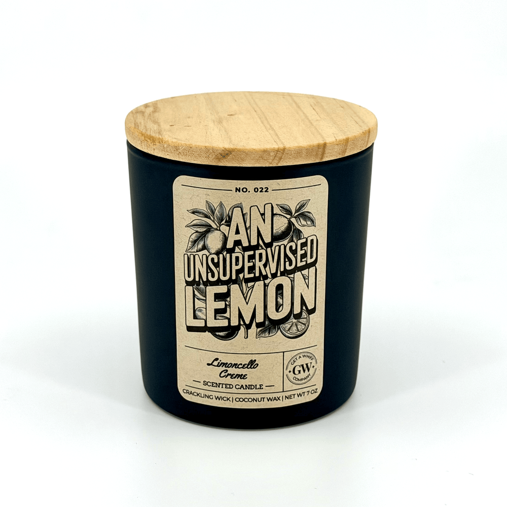 Black candle with wooden lid and label on a white background
