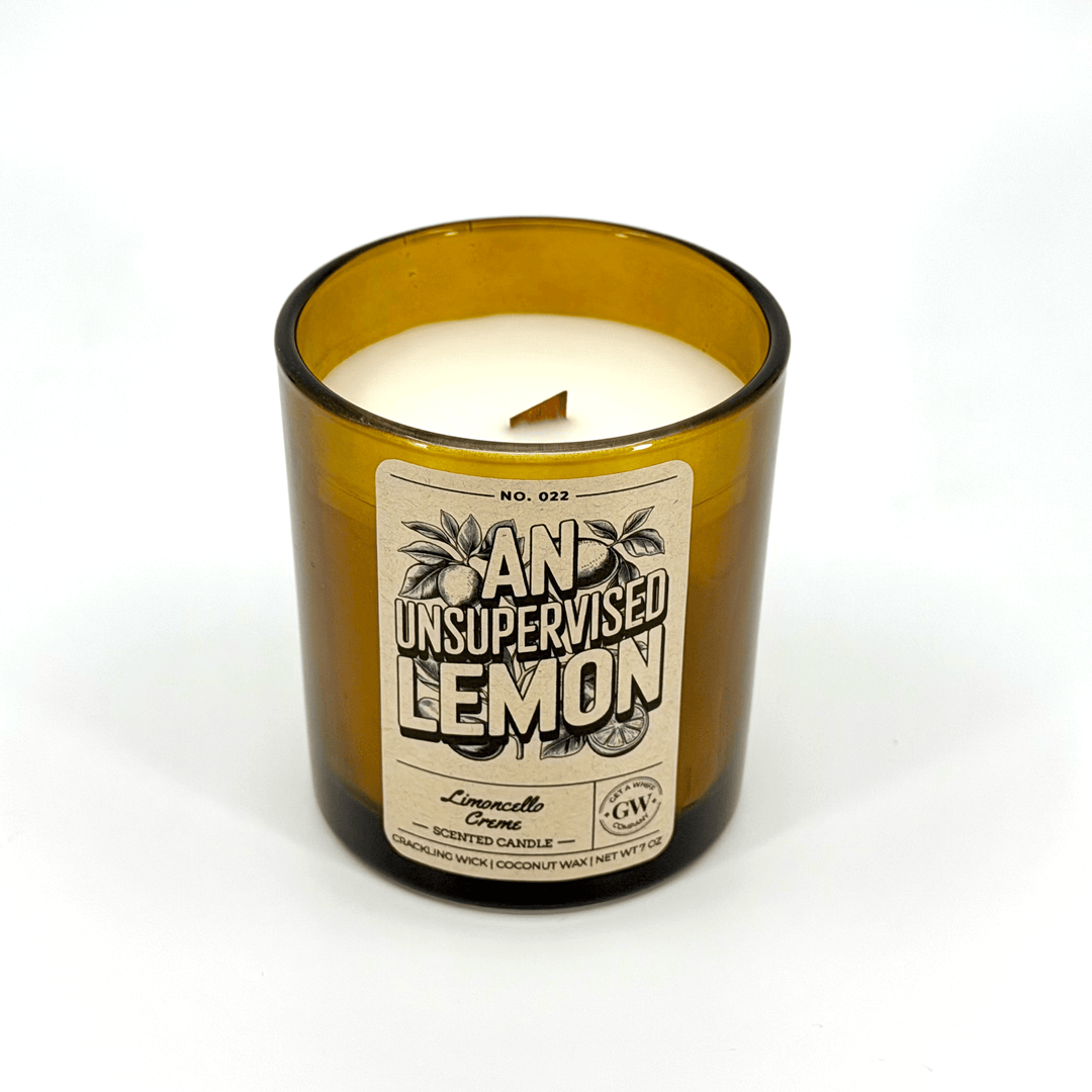Candle in a glass bottle with a label on a white background