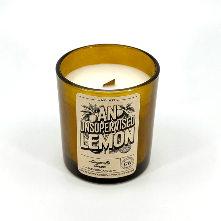 Candle in a glass bottle with a label on a white background