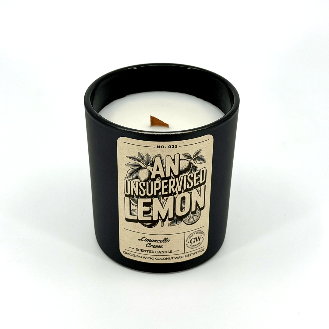 Black candle with a label on a white background