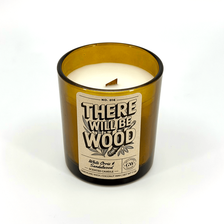 Candle in a bottle with a label on a white background