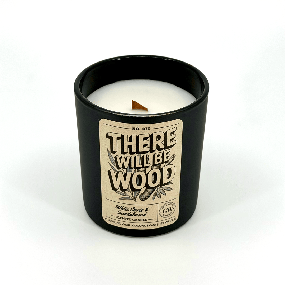 Black candle jar with a label on a white background