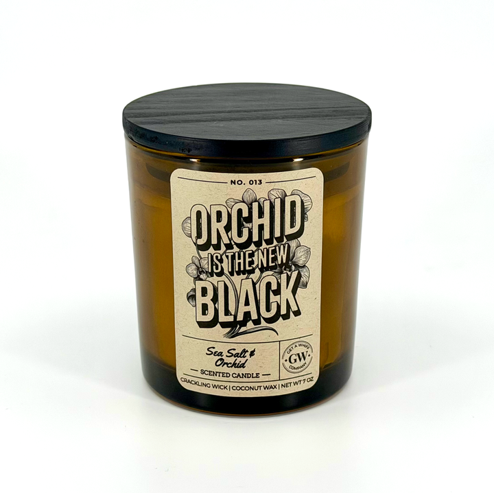 Candle jar with a label reading &