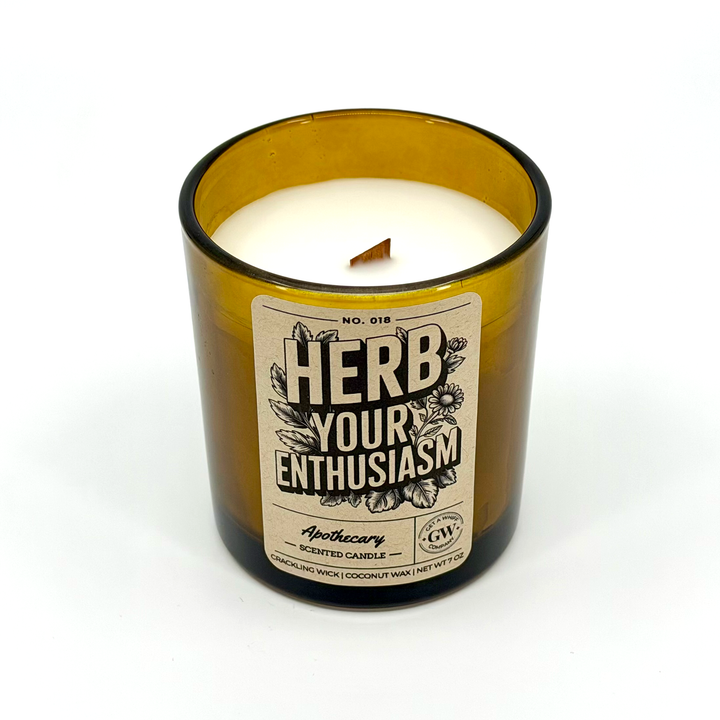 Candle in a glass jar with a label on a white background
