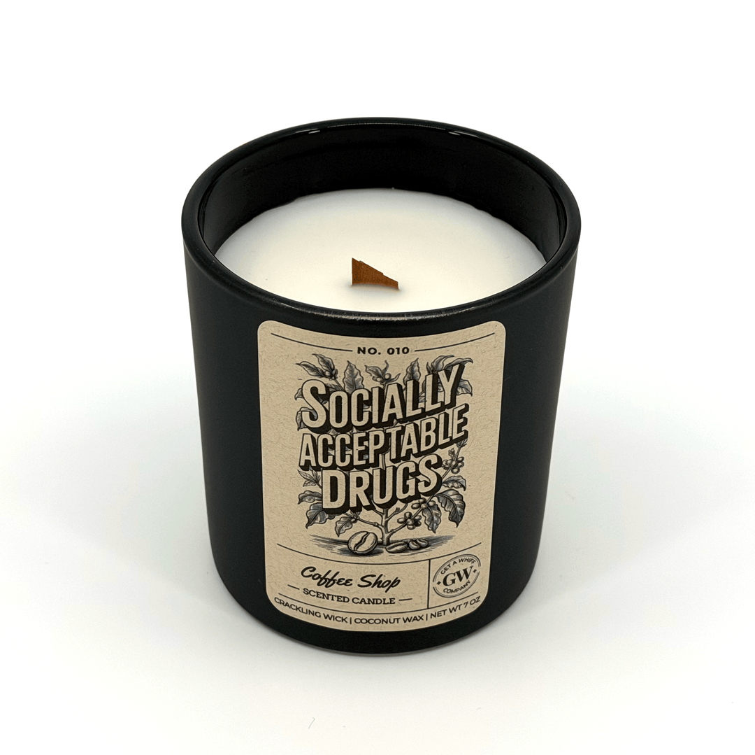 Candle in a black container with a label on a white background