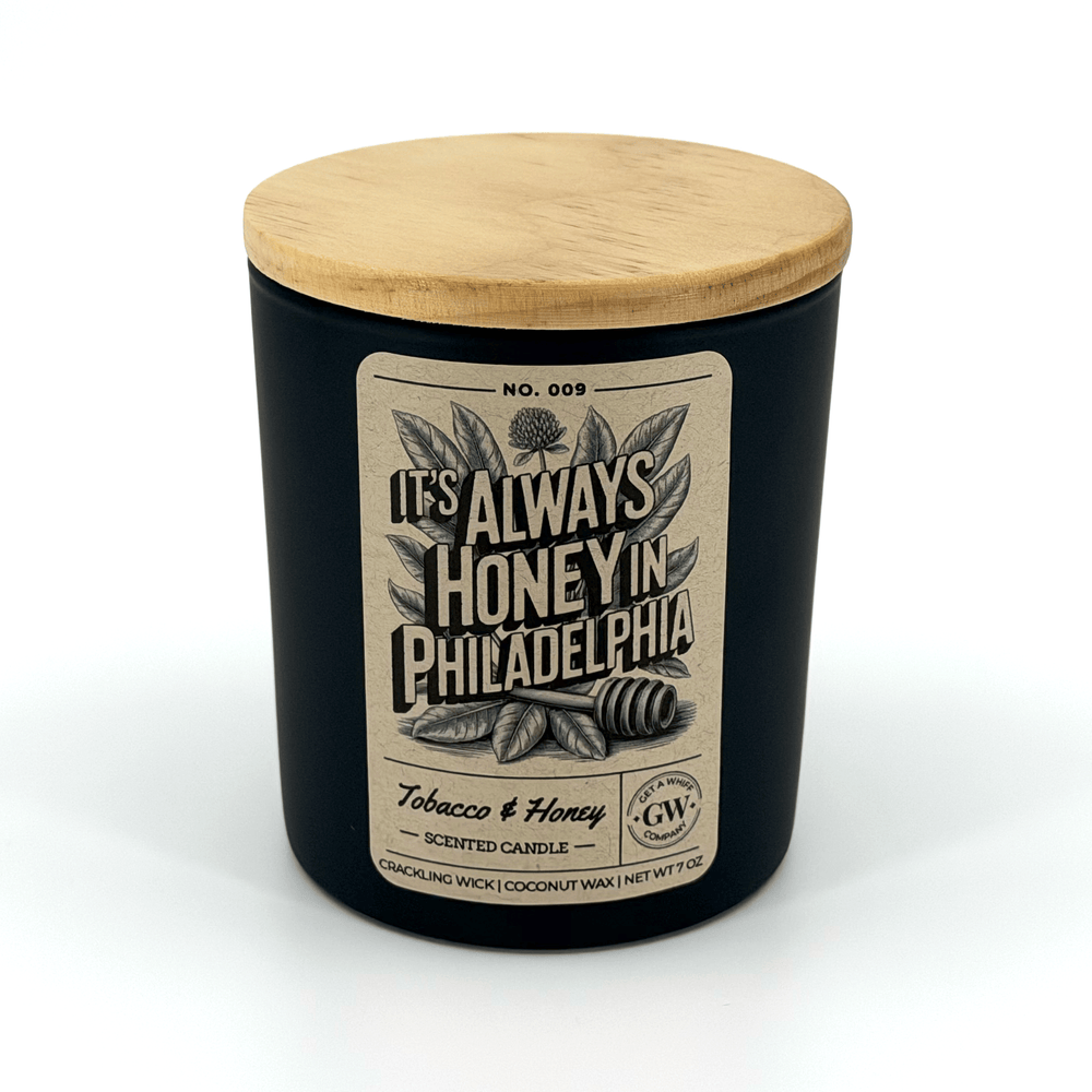 Scented candle with wooden lid and label on a white background