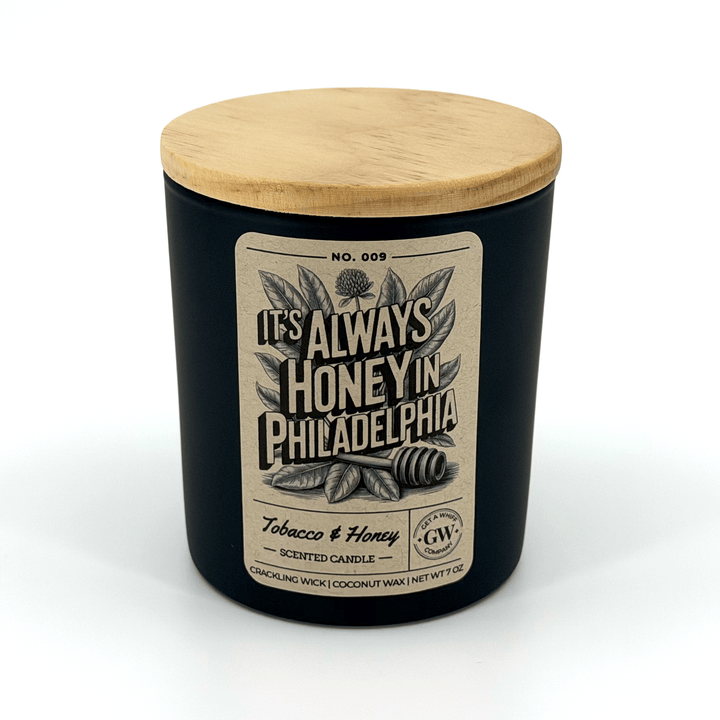 Scented candle with wooden lid and label on a white background