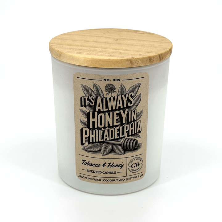 Candle with wooden lid and label on a white background