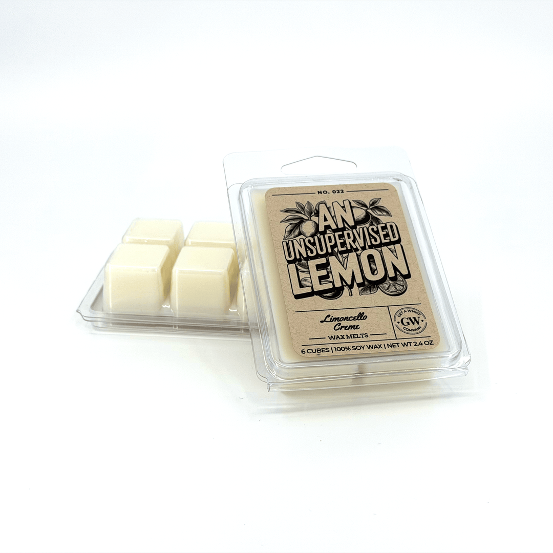 Wax melts in a clear plastic packaging with a label on a white background